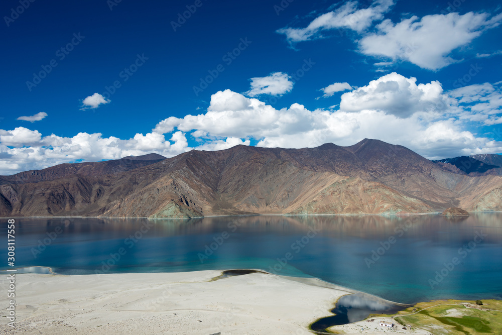 Naklejka premium Ladakh, India - Aug 05 2019 - Pangong Lake view from Merak Village in Ladakh, Jammu and Kashmir, India. The Lake is an endorheic lake in the Himalayas situated at a height of about 4350m.