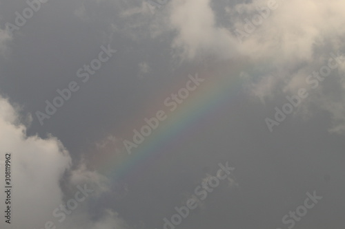 Rainbow in a cloudy sky. © Olivier Vandeginste