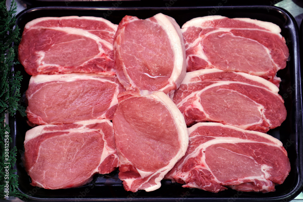 Pork sirloins arranged in a butcher's tray Pork sirloins arranged in a butcher's tray