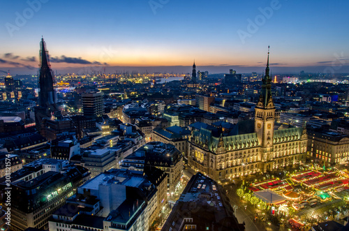 Hamburg at Christmas with the christmas market in the front of the town hall
