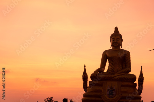 Buddha at sunset on the island of Phuket in Thailand