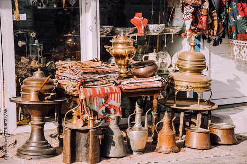 To sell out.Market in Bodrum. Authentic counter.Old turkish decor Carpets,teapots,sewing machine.Flea market in Turkey.Second hand in Bodrum.Antique store. photo