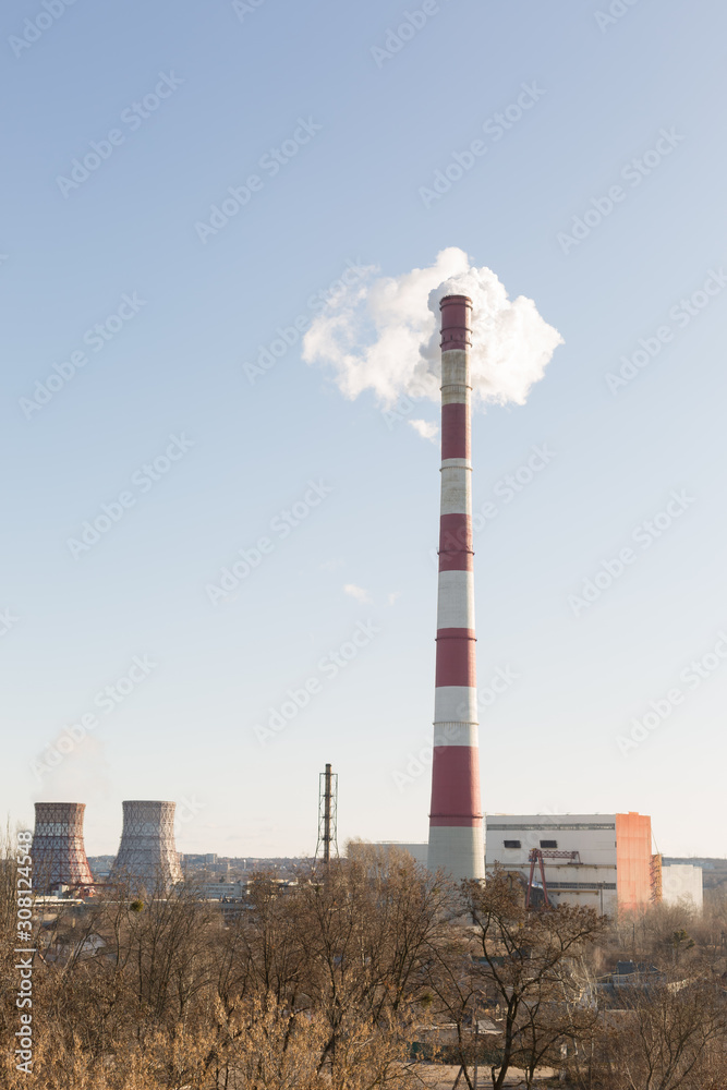 Pollution of the environment, with the pipe smoke in the background of clear sky Pollution of the environment, with the pipe smoke in the background of clear sky