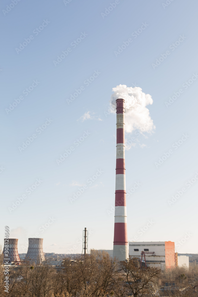 Pollution of the environment, with the pipe smoke in the background of clear sky Pollution of the environment, with the pipe smoke in the background of clear sky
