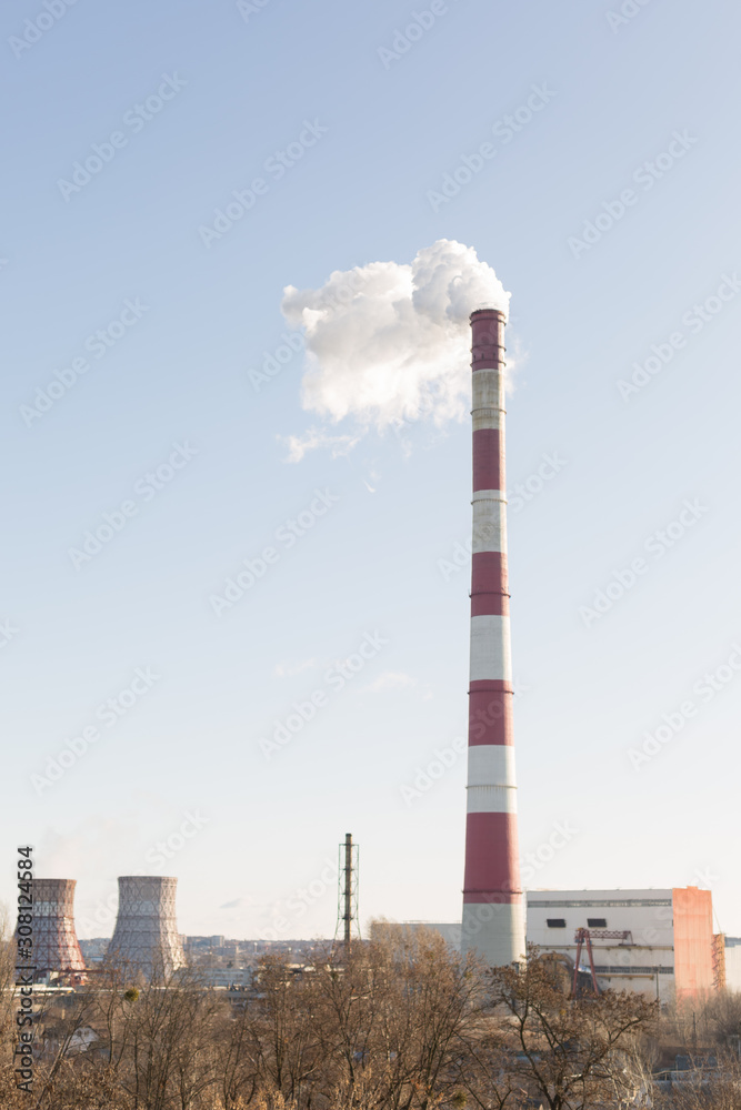 Pollution of the environment, with the pipe smoke in the background of clear sky