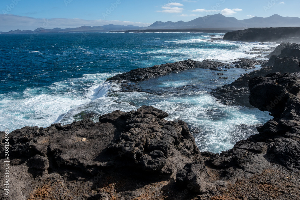 landscape of lanzarote vulcanic shore with clifs