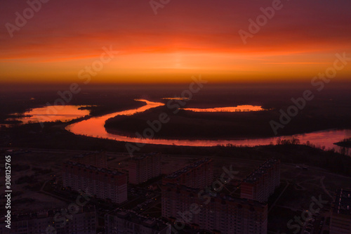 Bright red dawn over the city. Gomel at dawn. City shooting from above.