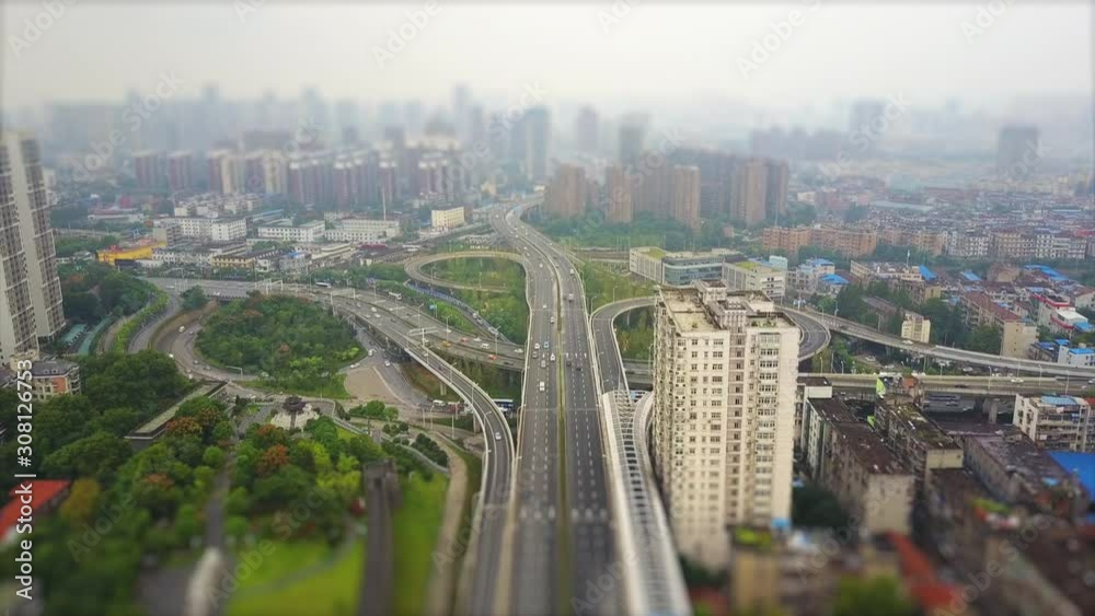 wuhan cityscape day time traffic road junction aerial panorama 4k tilt shift china wuhan cityscape day time traffic road junction aerial panorama 4k tilt shift china