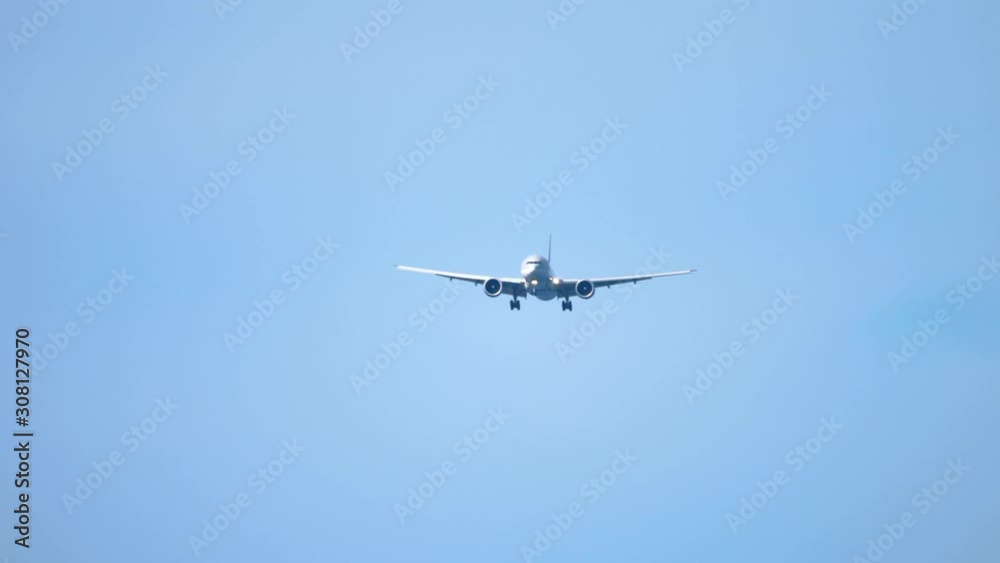 Airplane approaching over ocean Airplane approaching over ocean