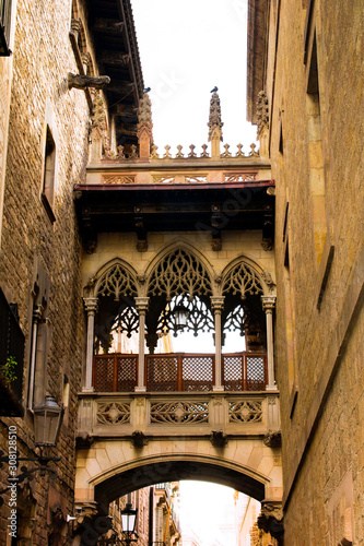 Neogothic-style bridge by architect Joan Rubió was built in 1928 over Carrer del Bisbe, near Placa del Rei and Placa Sant Jaume, in the heart of Barri Gotic. Barcelona, Catalonia, Spain. photo