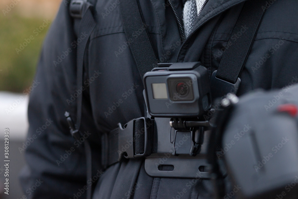 Action camera in the chest mount, closeup, horizontal Action camera in the chest mount, closeup, horizontal