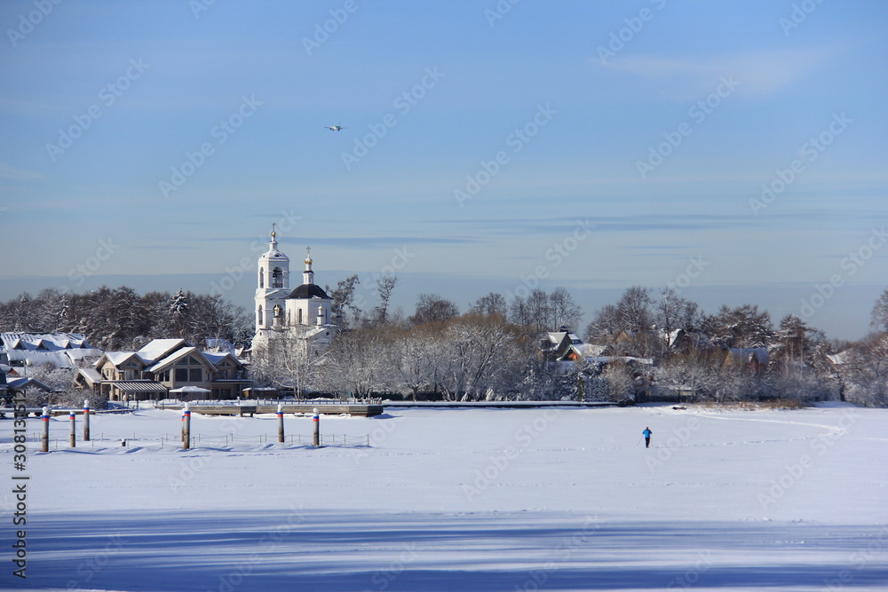 winter landscape with the church at countryside in Russia