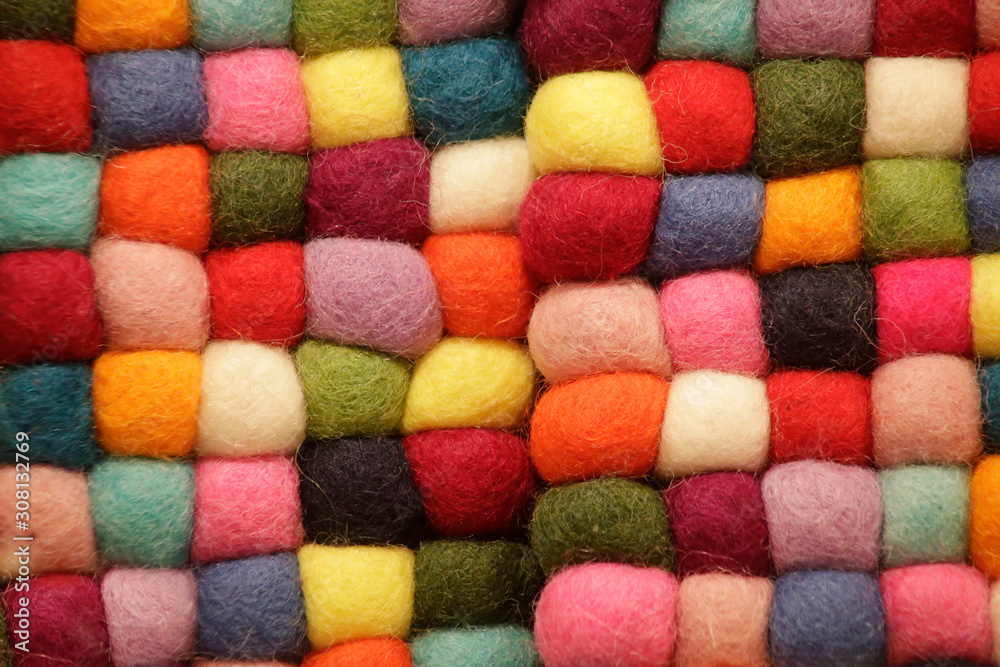 Wool yarn balls. Multicolor threads. Abstract material background on the subject of needlework, handmade crafts, decor and design. Wool yarn balls. Multicolor threads. Abstract material background on the subject of needlework, handmade crafts, decor and design.