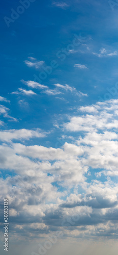 Fantastic clouds against blue sky, panorama