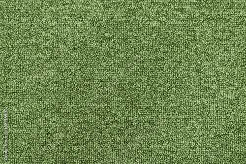 Seamless green generic carpet fabric pattern background texture.