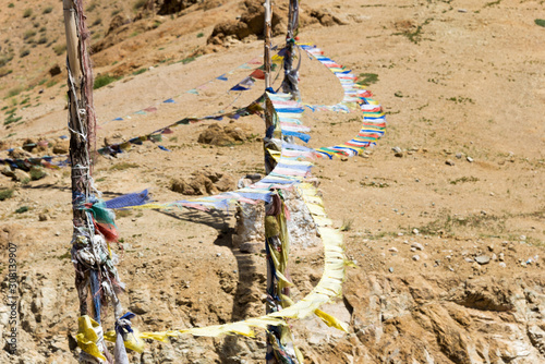 Ladakh, India - Aug 22 2019 - Tibetan Prayer Flag at Sermangchan La Pass (Tsermangchan La Pass) 3897m view from Between Yangtang and Hemis Shukpachan in Sham Valley, Ladakh, Jammu and Kashmir, India. photo