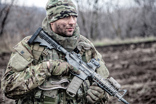 Fotografi Portrait of modern army infantryman on march