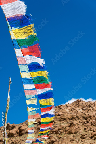 Ladakh, India - Aug 22 2019 - Tibetan Prayer Flag at Sermangchan La Pass (Tsermangchan La Pass) 3897m view from Between Yangtang and Hemis Shukpachan in Sham Valley, Ladakh, Jammu and Kashmir, India. photo