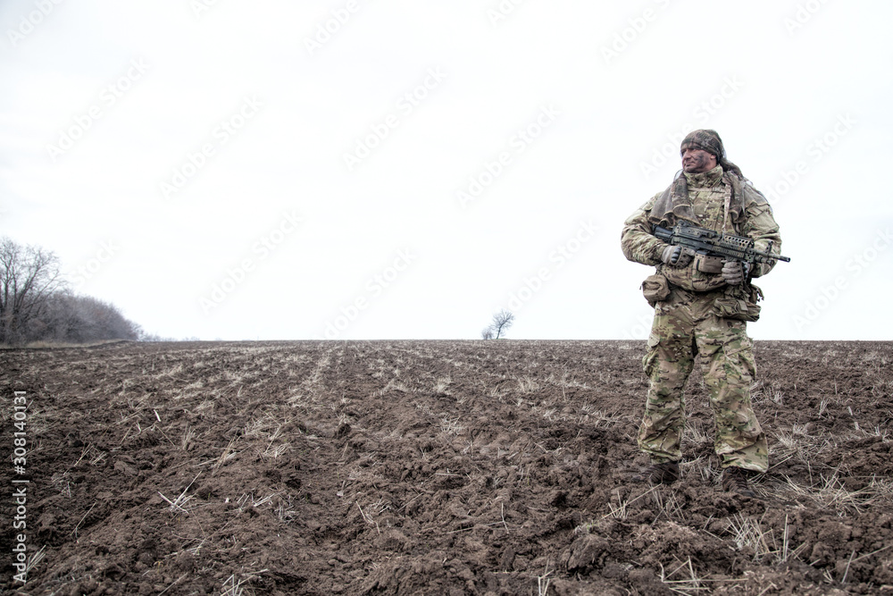 Army special forces machine gunner in field Army special forces machine gunner in field