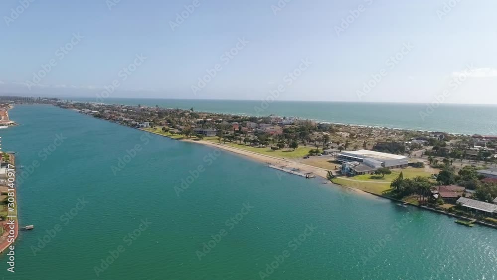 Shot over West Lakes in Tennyson, Adelaide, looking out towards the beach and ocean. Aerial pull back Shot over West Lakes in Tennyson, Adelaide, looking out towards the beach and ocean. Aerial pull back