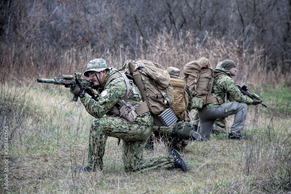 army soldiers military tactical teamwork in forest army soldiers military tactical teamwork in forest