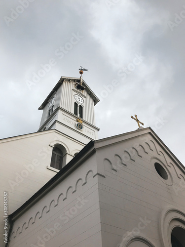 View of church steeple against clouds