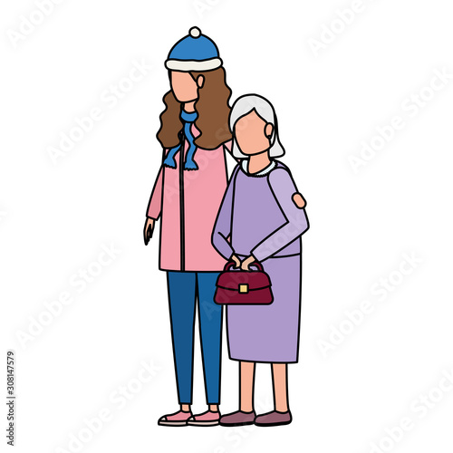 cute grandmother with daughter using christmas hat