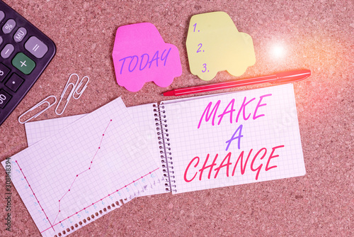 Text sign showing Make A Change. Business photo text Create a Difference Alteration Have an Effect Metamorphose Desk notebook paper office cardboard paperboard study supplies table chart photo