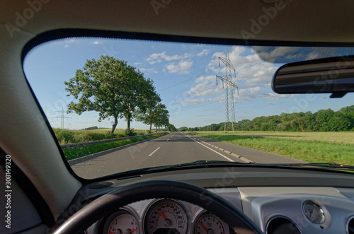 driving on a country road on a sunny day