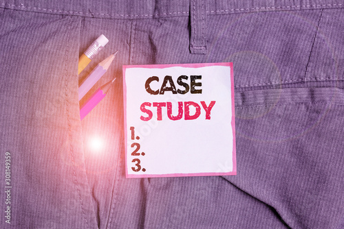 Writing note showing Case Study. Business concept for research methodology that has commonly used in social sciences Writing equipment and blue note paper in pocket of trousers