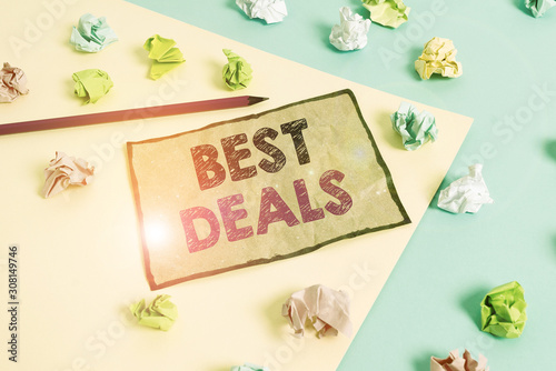 Handwriting text writing Best Deals. Conceptual photo very successful transaction or business agreement or a bargain Colored crumpled papers empty reminder blue yellow background clothespin © Artur