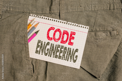 Conceptual hand writing showing Code Engineering. Concept meaning application of engineering to the development of software Writing equipment and white note paper inside pocket of trousers