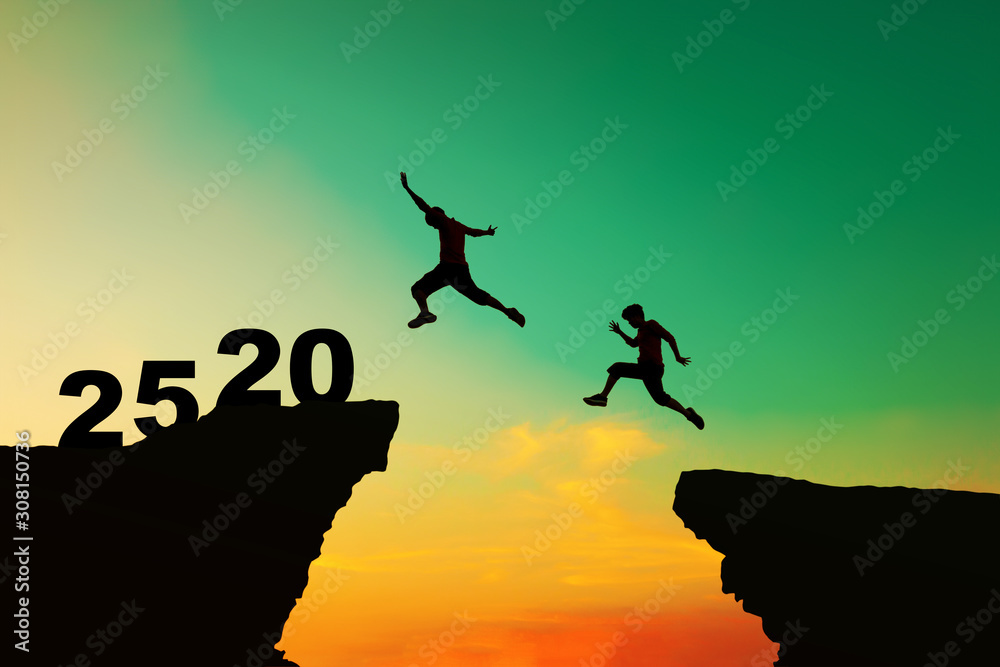 Happy new year 2020 concept, People jumped from the old obstacles to new achievements. Happy new year 2020 concept, People jumped from the old obstacles to new achievements.