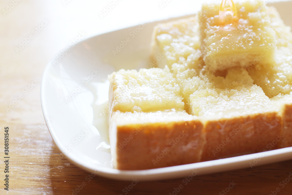 Butter bread slice with sweetened condensed milk at cafe.