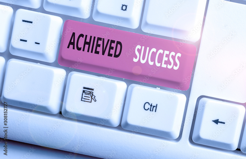 Conceptual hand writing showing Achieved Success. Concept meaning the achievement of desired visions and planned goals White pc keyboard with note paper above the white background Conceptual hand writing showing Achieved Success. Concept meaning the achievement of desired visions and planned goals White pc keyboard with note paper above the white background