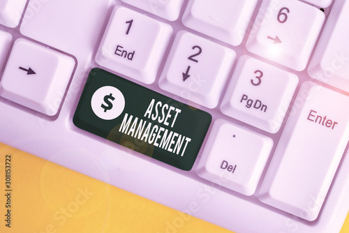 Handwriting text writing Asset Management. Conceptual photo analysisaged investment of assets of a demonstrating or business White pc keyboard with empty note paper above white background key copy photo