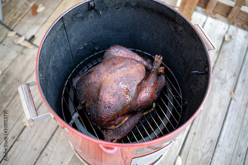 Cooked turkey in inside an electric smoker.