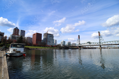 Portland Oregon skyline seen from a pier on the Willamette River.