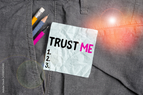 Word writing text Trust Me. Business photo showcasing Believe Have faith in other demonstrating Offer support assistance Writing equipment and blue note paper inside pocket of man work trousers