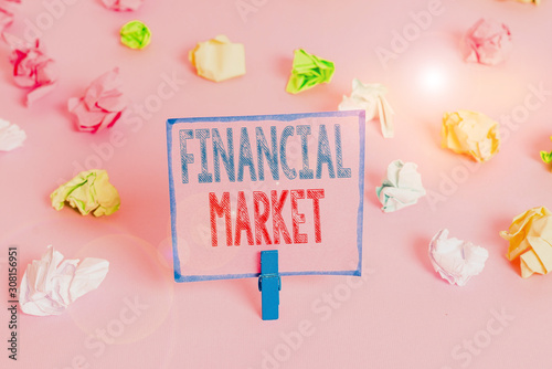 Word writing text Financial Market. Business photo showcasing market in which showing trade financial securities Colored crumpled papers empty reminder pink floor background clothespin