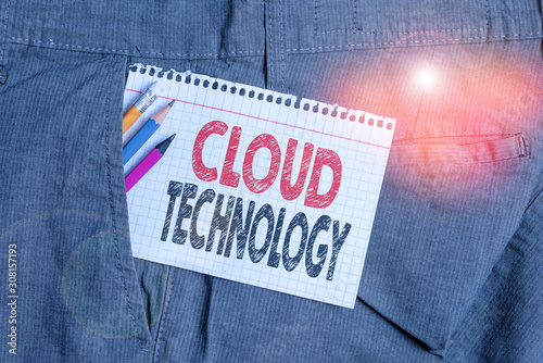 Conceptual hand writing showing Cloud Technology. Concept meaning on deanalysisd availability of computer system resources Writing equipment and white note paper inside pocket of trousers photo