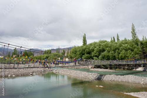 Ladakh, India - Jun 26 2019 - MAITRI BRIDGE on Indus River in Choglamsar, Ladakh, Jammu and Kashmir, India. photo