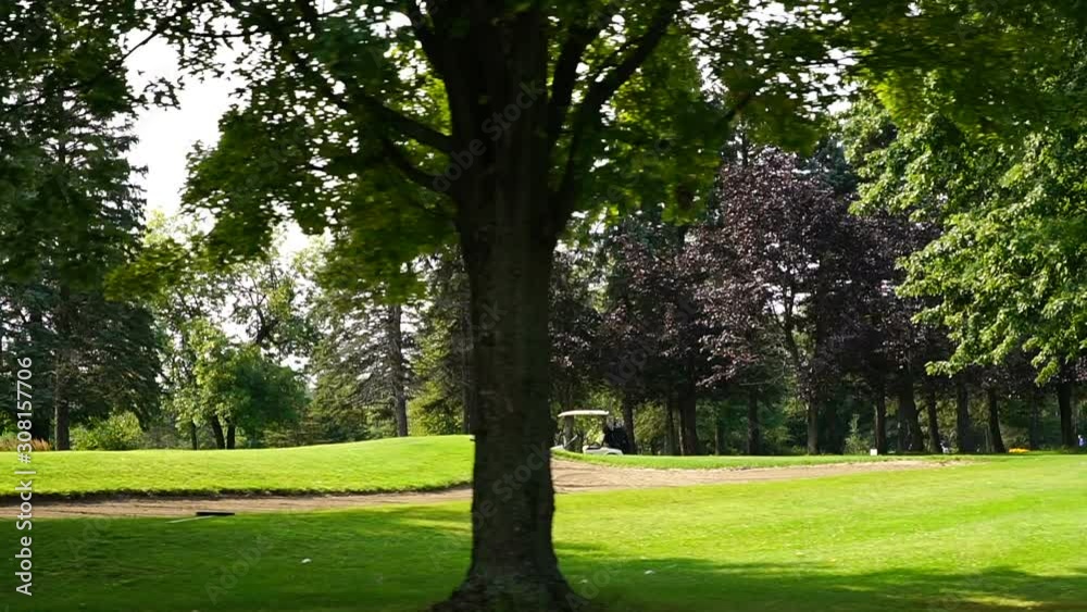 Golf Course During Sunny Day (Steady Slow Motion) Golf Course During Sunny Day (Steady Slow Motion)