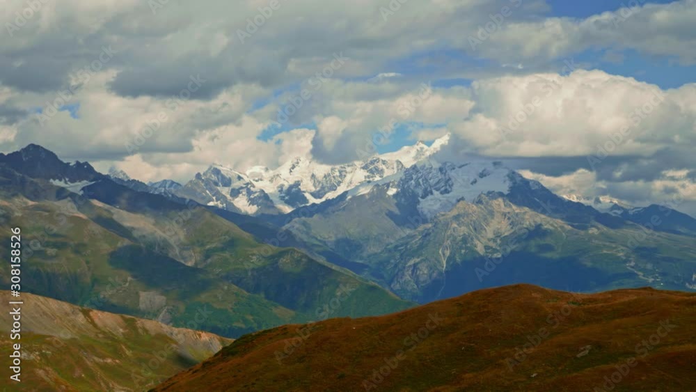 View of Tetnuldi summit and glacier in Caucasus mountains on cloudy summer day, Georgia View of Tetnuldi summit and glacier in Caucasus mountains on cloudy summer day, Georgia