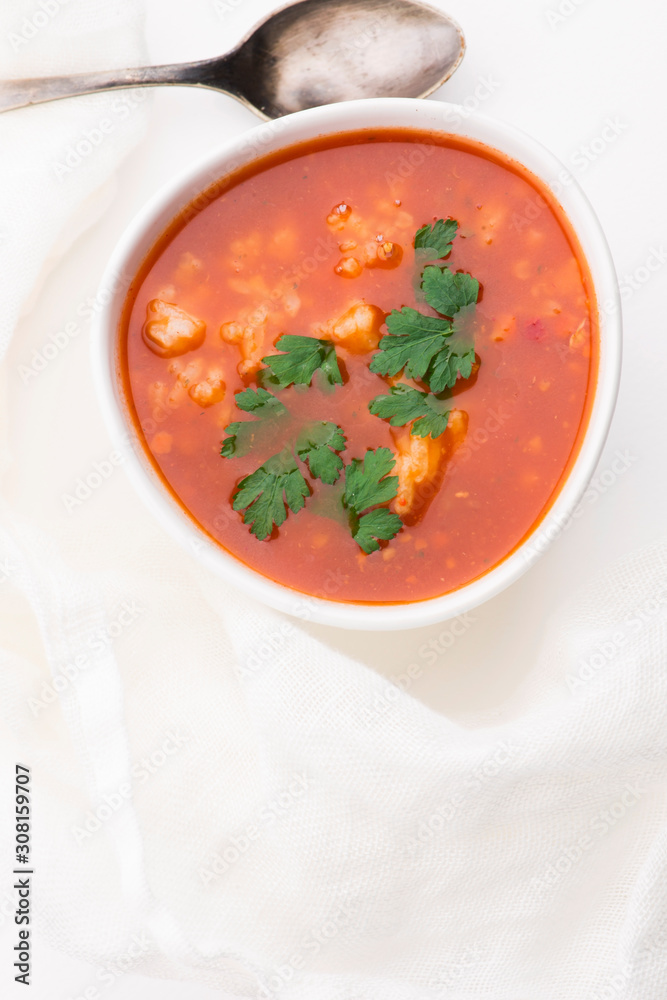 Tomato soup with rice decorated with parsley Tomato soup with rice decorated with parsley