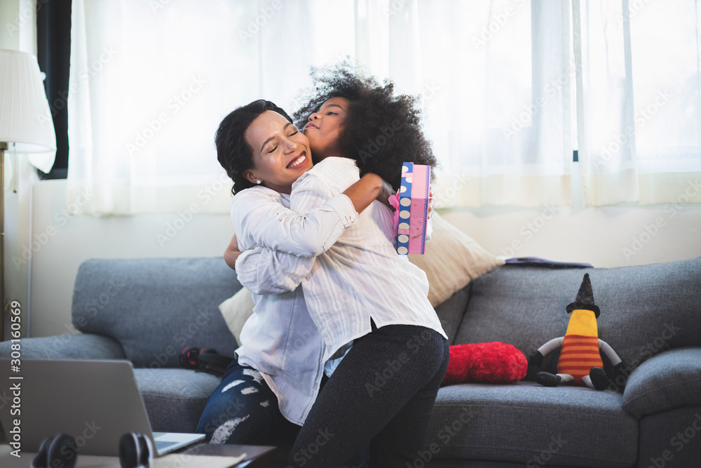 Family holiday and togetherness. Mother and girls smiling and hugging. Family holiday and togetherness. Mother and girls smiling and hugging.