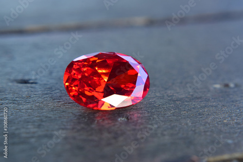  ruby Is a beautiful red gemstone on a wooden floor photo