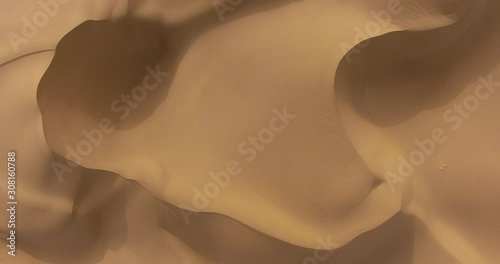 aerial view of sand and waves