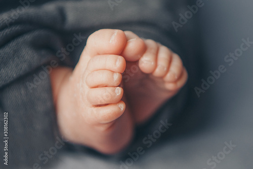 Newborn Baby's feet. legs massage concept of childhood, health care, IVF, hygiene