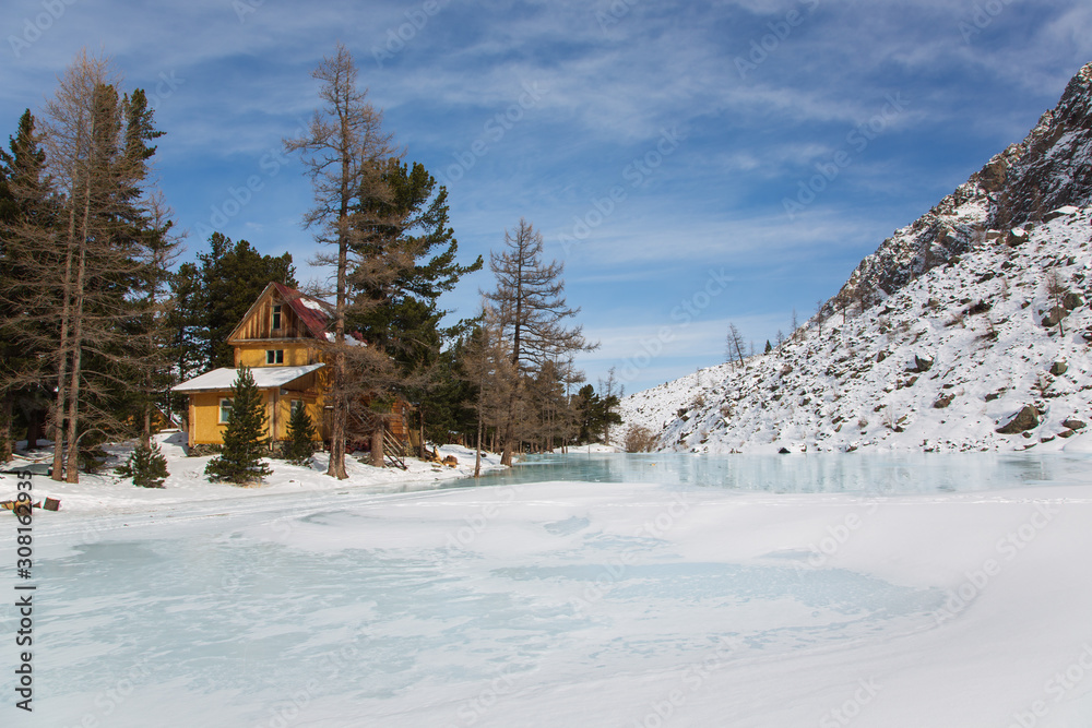Altai mountain frozen lake with big stones